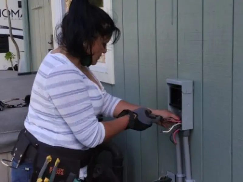 Licensed electrician wiring an exterior subpanel in Ellensburg